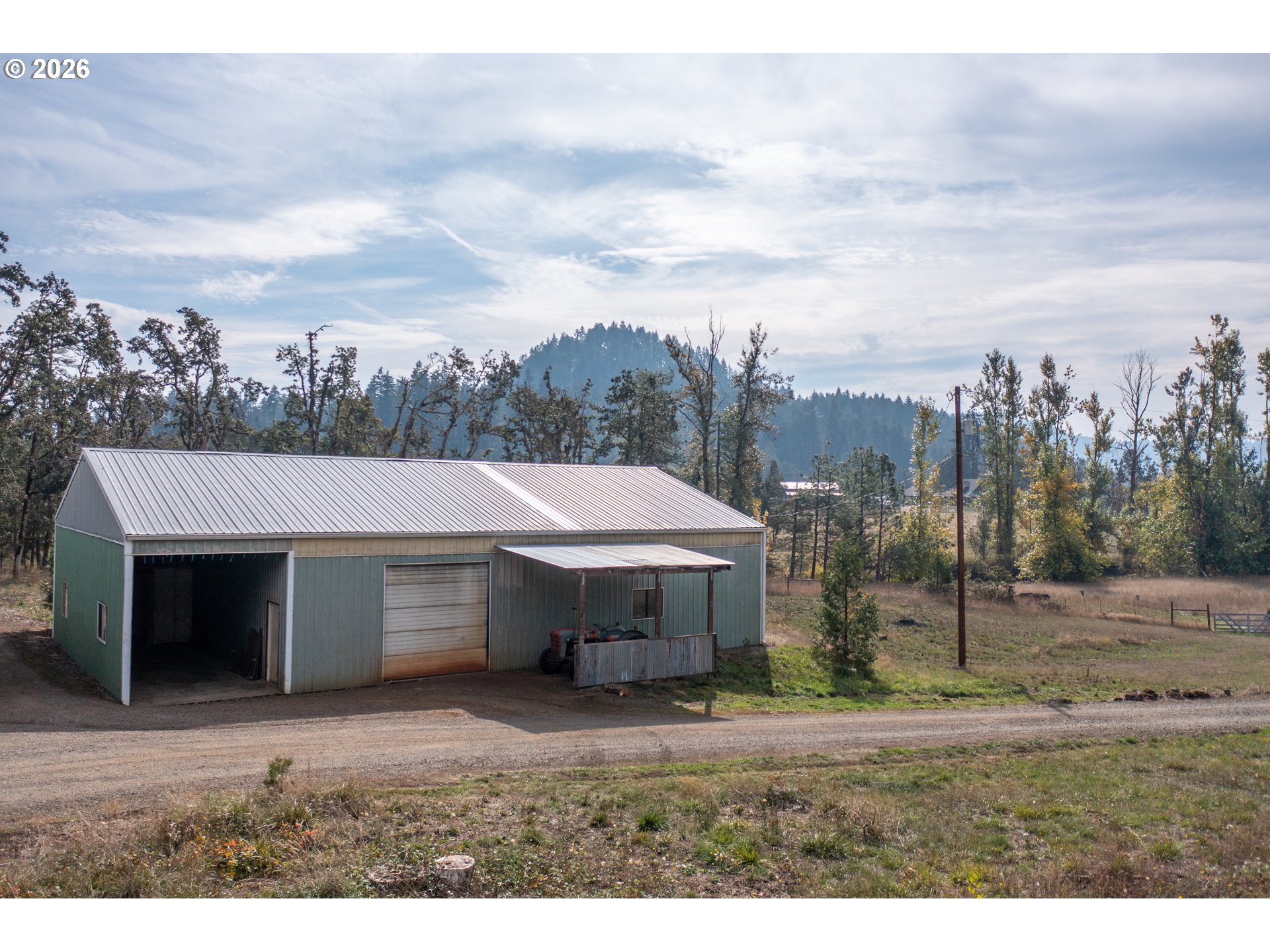 37075 Camp Creek Road Springfield, OR 97478 - Photo 34 of 48 a front view of a house with a yard and garage