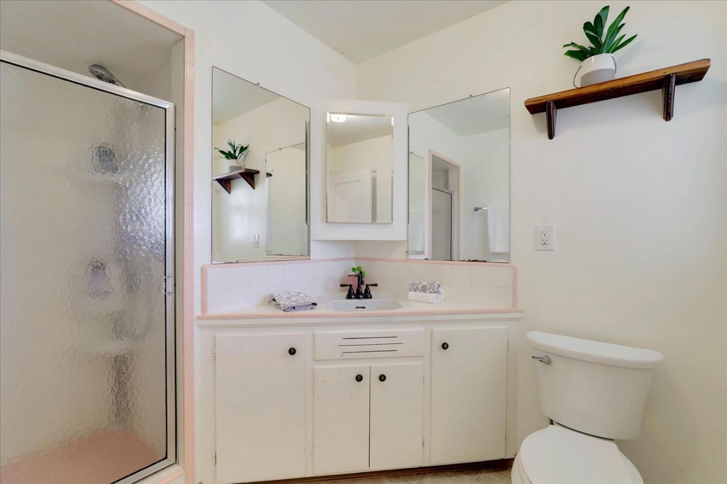 970 Stonehurst Way Campbell, CA 95008 - Photo 16 of 21 a bathroom with a sink toilet vanity and shower