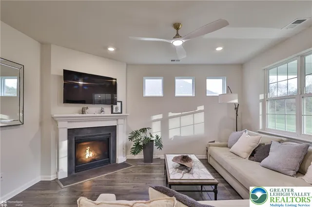 a spacious bathroom with a double vanity sink a mirror and a shower
