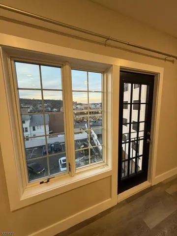 a view of a glass door and a window