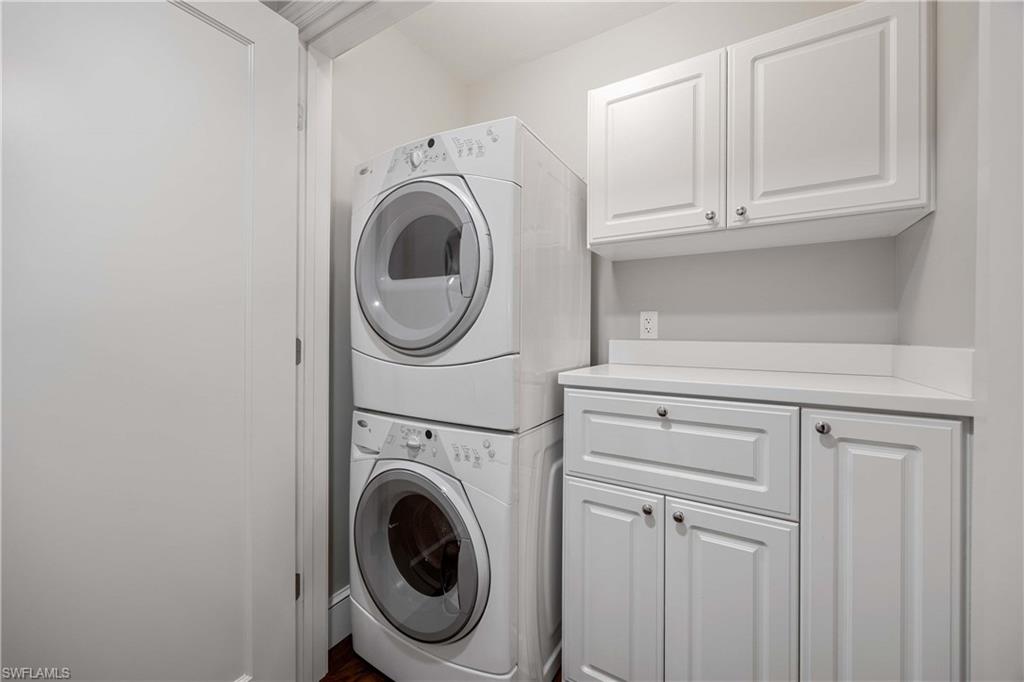 9123 Strada Place, Unit 7404 Naples, FL 34108 - Photo 18 of 36 a utility room with dryer and washer