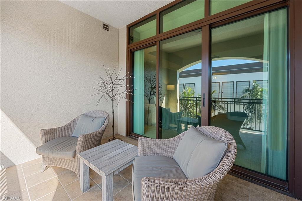 9123 Strada Place, Unit 7404 Naples, FL 34108 - Photo 19 of 36 a living room with furniture