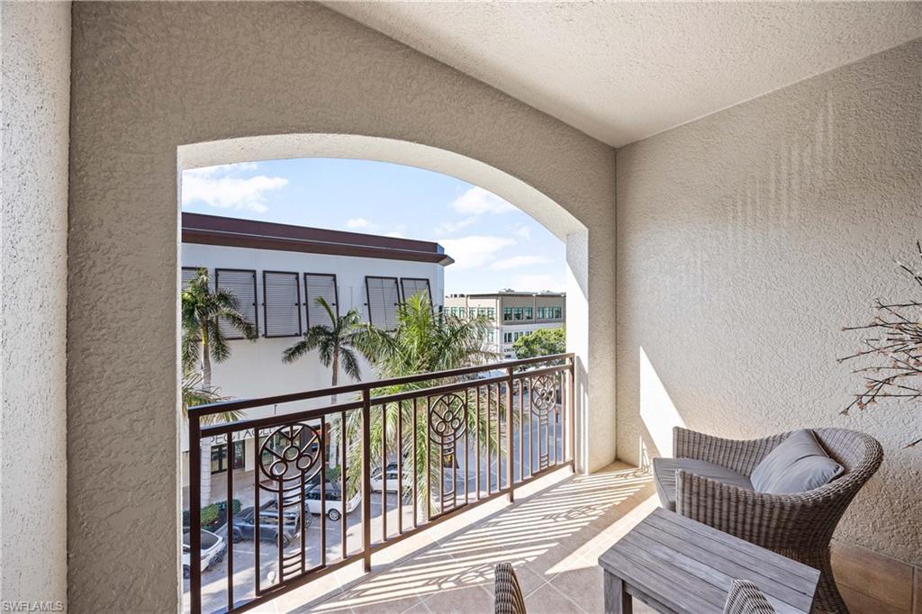 9123 Strada Place, Unit 7404 Naples, FL 34108 - Photo 20 of 36 a view of balcony with furniture