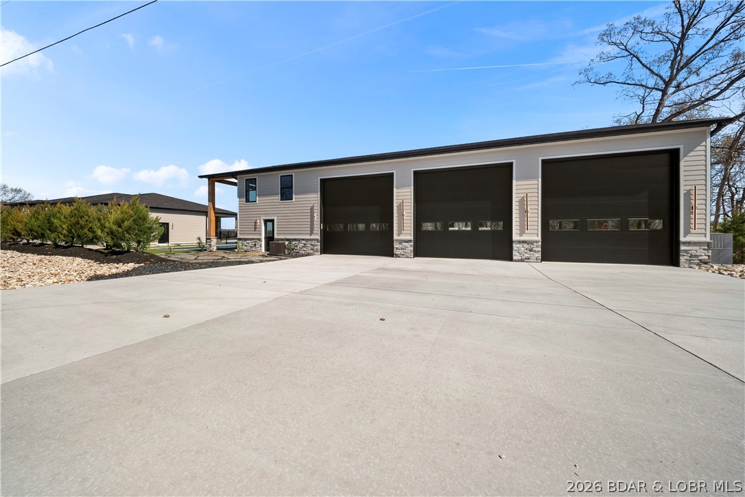 1356 Duckhead Road Lake Ozark, MO 65049 - Photo 88 of 99 Shop/Garage Doors + Huge, Flat Driveway. Plenty of