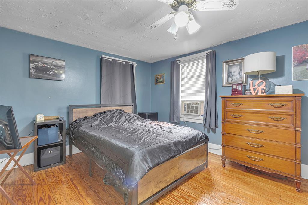 195 Highway 68 Rochester, PA 15074 - Photo 15 of 25 a bedroom with a bed a dresser and chair