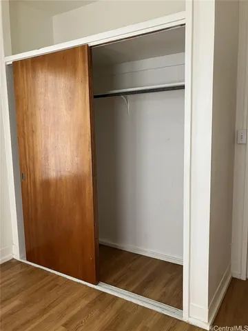 an empty room with wooden floor