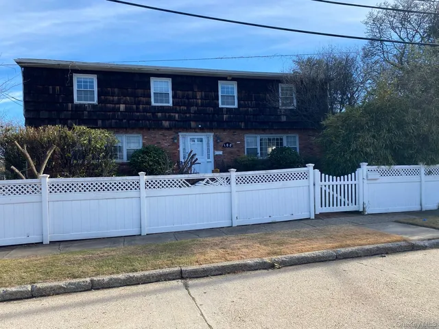 a view of a house with a fence