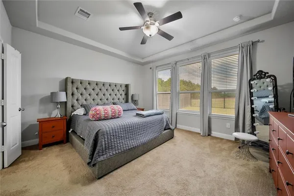 a bedroom with a bed and a walk in closet