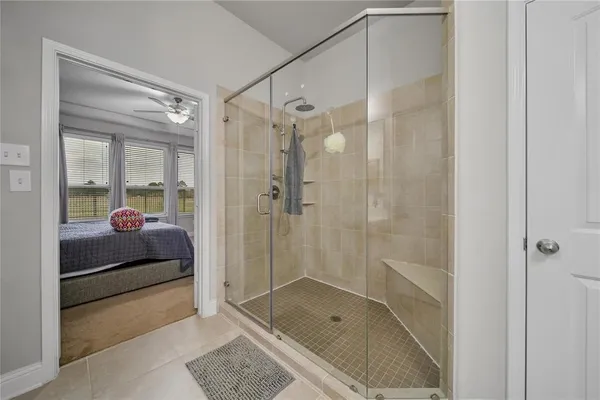 a bathroom with a shower and a sink