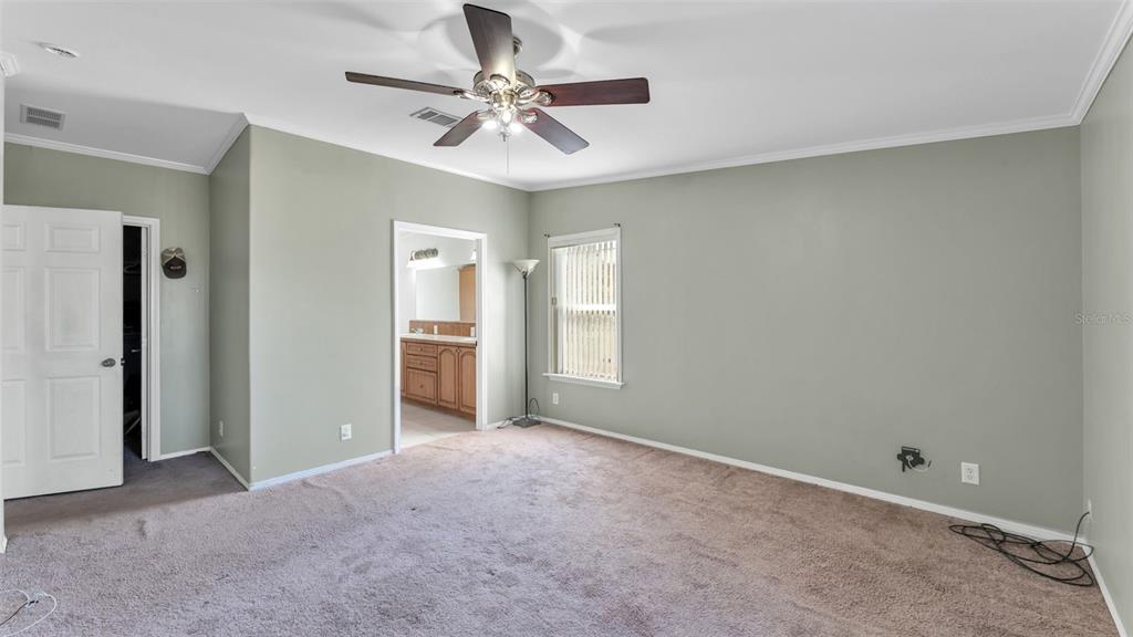 7549 Sinkhole Road Bartow, FL 33830 - Photo 12 of 40 a view of a big room with windows and chandelier fan