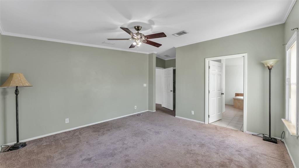 7549 Sinkhole Road Bartow, FL 33830 - Photo 13 of 40 a view of an empty room and a ceiling fan window