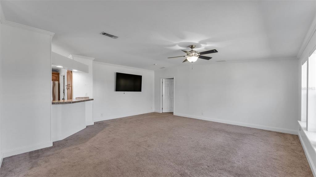 7549 Sinkhole Road Bartow, FL 33830 - Photo 16 of 40 a view of a livingroom with a ceiling fan and a window