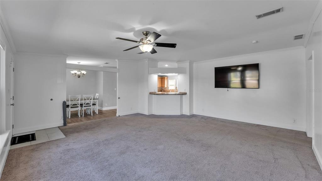 7549 Sinkhole Road Bartow, FL 33830 - Photo 17 of 40 a view of a livingroom with furniture and a ceiling fan