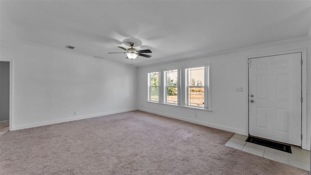 7549 Sinkhole Road Bartow, FL 33830 - Photo 18 of 40 a view of an empty room with a window