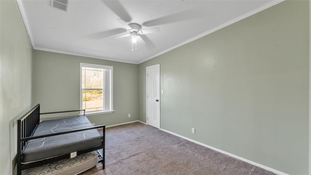 7549 Sinkhole Road Bartow, FL 33830 - Photo 31 of 40 an empty room with windows