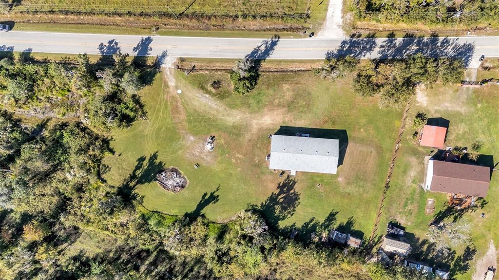 7549 Sinkhole Road Bartow, FL 33830 - Photo 32 of 40 an aerial view of a house with a garden