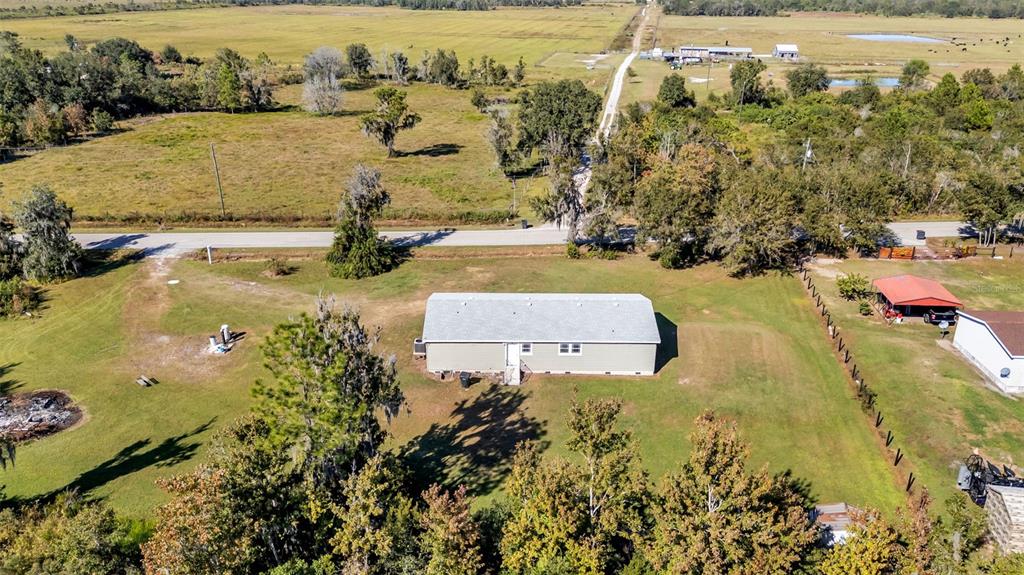 7549 Sinkhole Road Bartow, FL 33830 - Photo 34 of 40 an aerial view of residential houses with outdoor space
