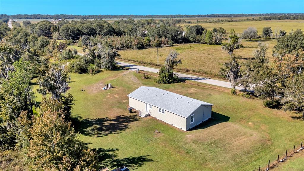 7549 Sinkhole Road Bartow, FL 33830 - Photo 35 of 40 an aerial view of a house with a yard