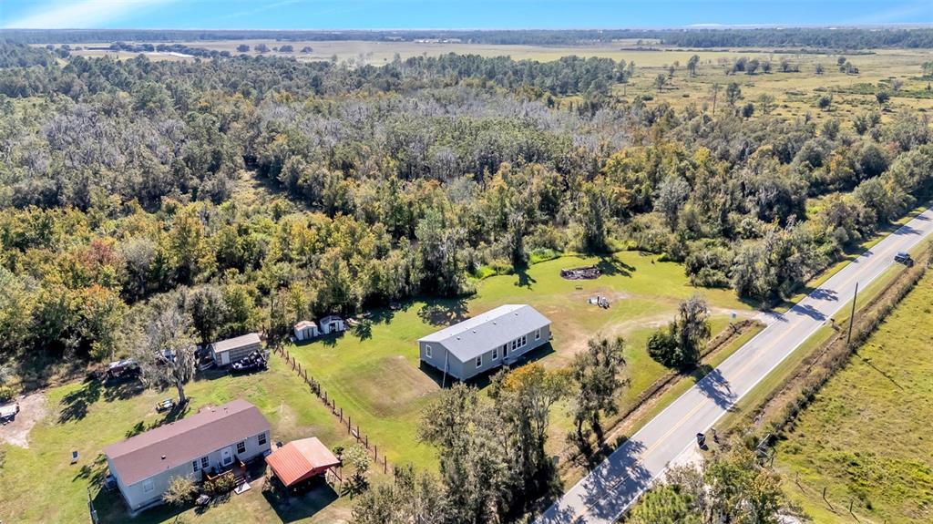 7549 Sinkhole Road Bartow, FL 33830 - Photo 37 of 40 an aerial view of a house with a yard