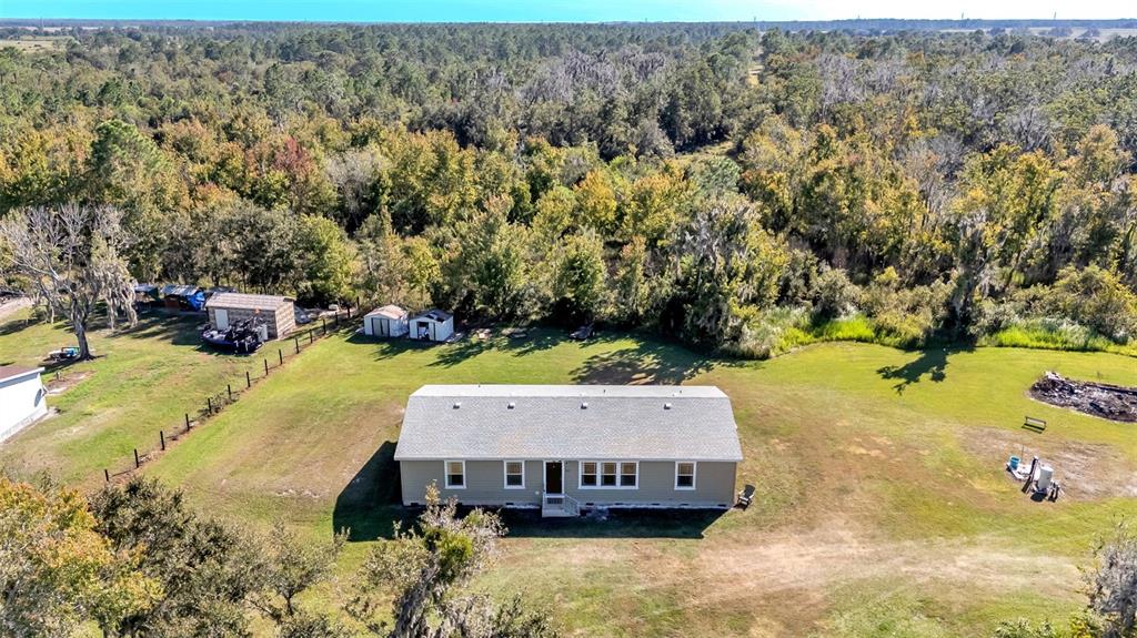 7549 Sinkhole Road Bartow, FL 33830 - Photo 38 of 40 a view of a swimming pool with a yard