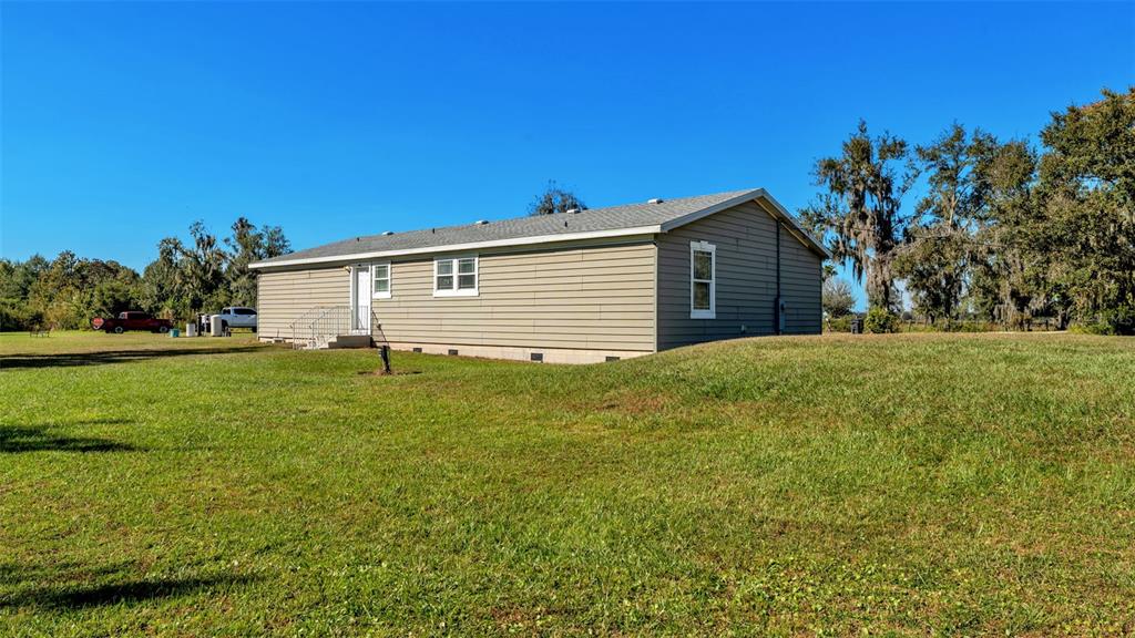 7549 Sinkhole Road Bartow, FL 33830 - Photo 6 of 40 a front view of house with yard and green space