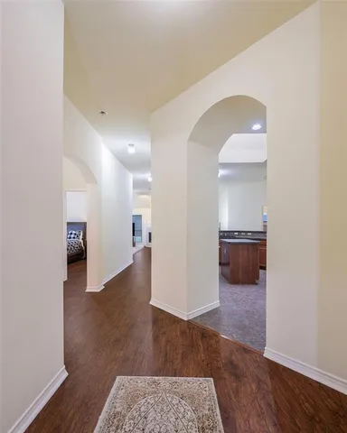 a view of a kitchen cabinets and wooden floor