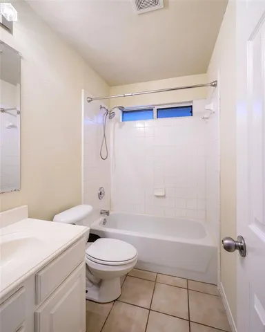 a bathroom with a toilet a sink and shower