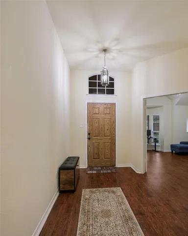 a view of a livingroom with furniture and wooden floor