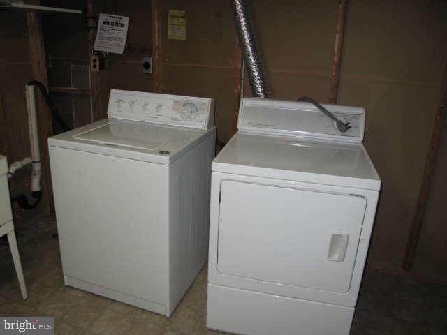 11034 Saffold Way Reston, VA 20190 - Photo 17 of 18 a utility room with dryer and washer