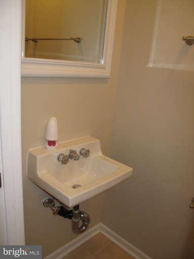 11034 Saffold Way Reston, VA 20190 - Photo 7 of 18 a bathroom with a sink