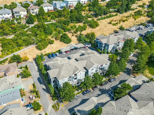 an aerial view of a house with a yard