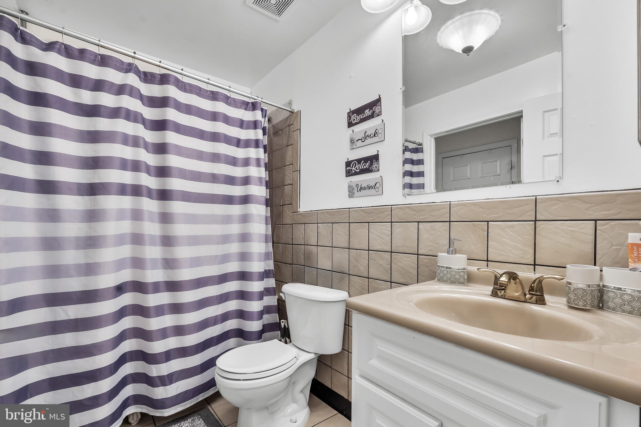 18 High Meadows Drive Sicklerville, NJ 08081 - Photo 22 of 25 a bathroom with a sink and mirror with toilet