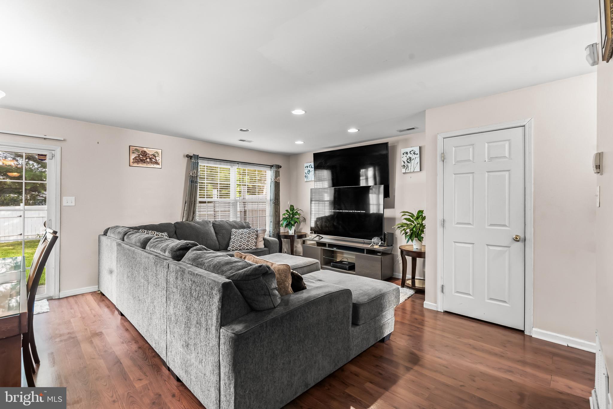 18 High Meadows Drive Sicklerville, NJ 08081 - Photo 9 of 25 a living room with furniture and a flat screen tv