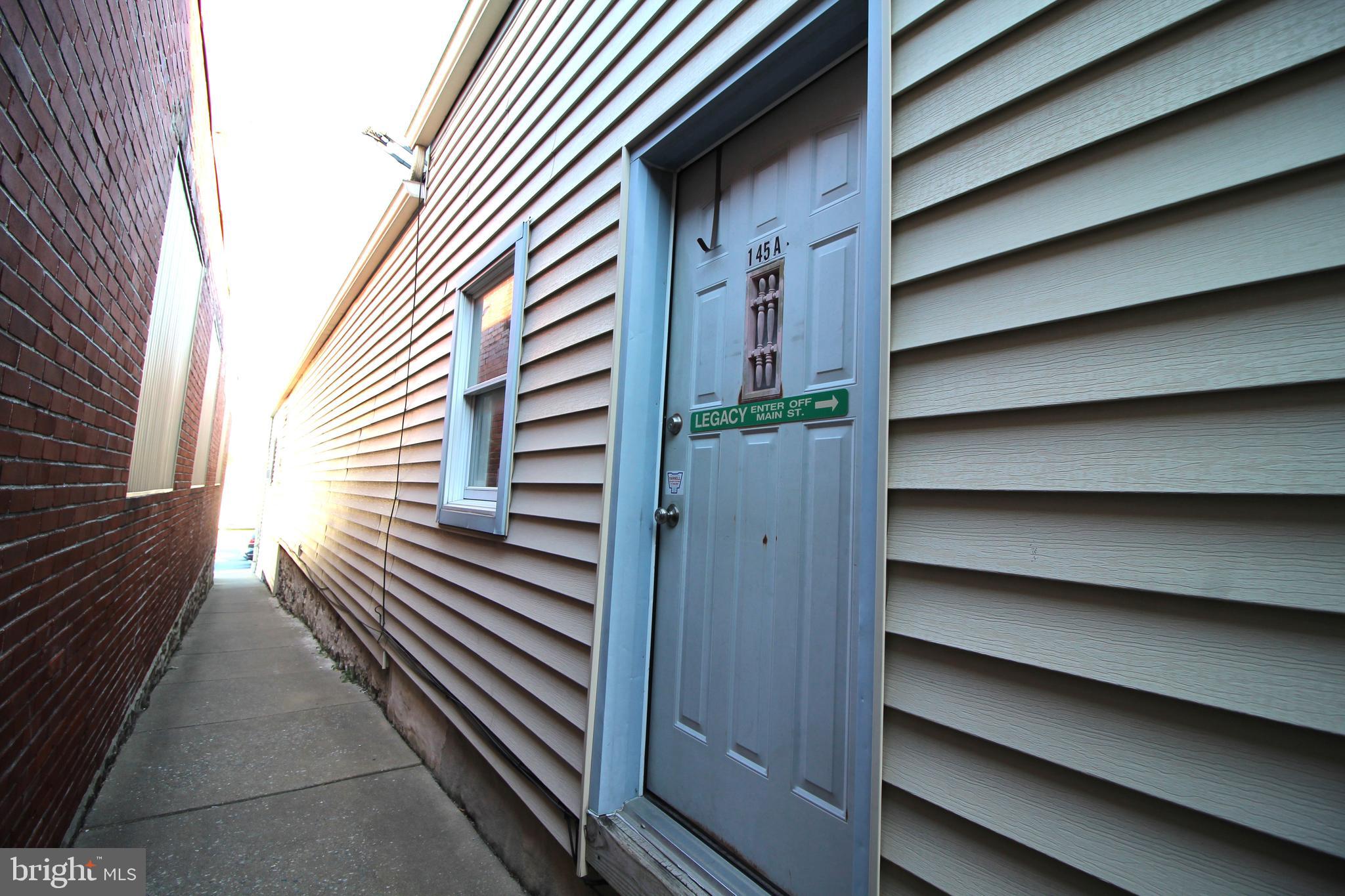 145 East A E Main Street New Holland, PA 17557 - Photo 2 of 9 a view of a house with a door and wooden floor