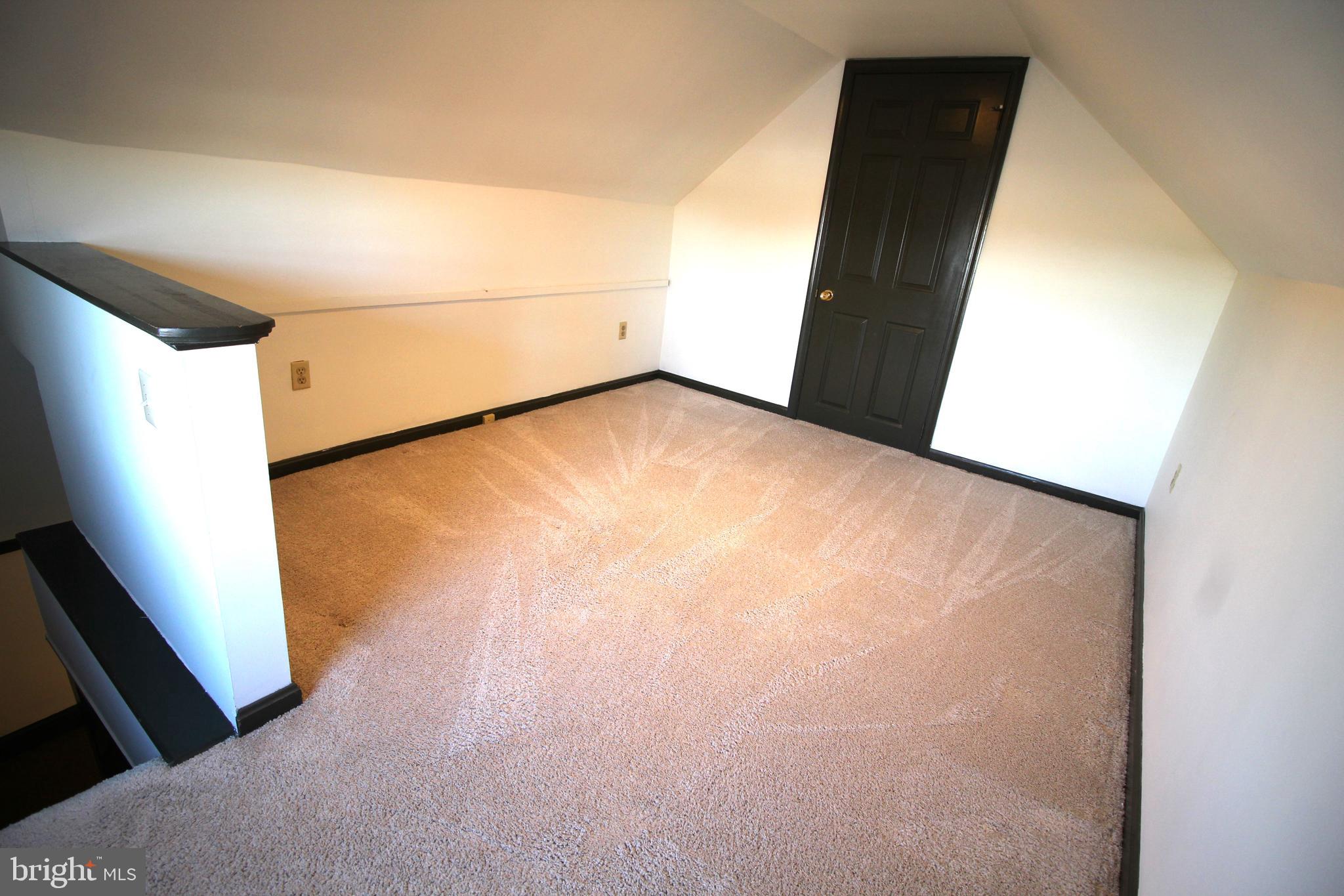 145 East A E Main Street New Holland, PA 17557 - Photo 7 of 9 a view of an empty room with wooden floor