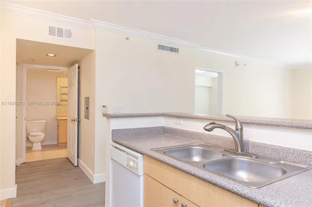 a bathroom with a sink and a large mirror