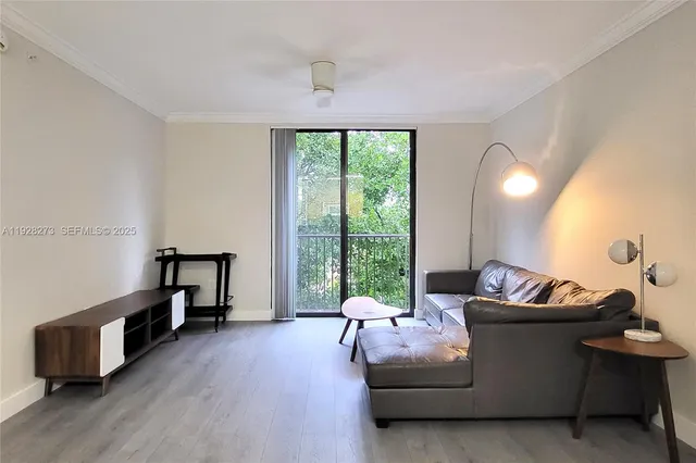 a living room with furniture and a window