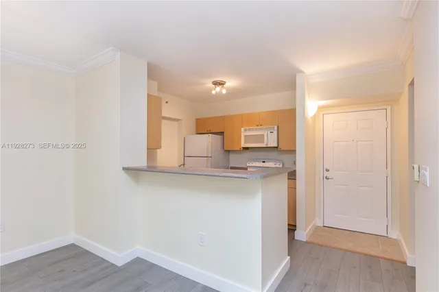 a view of a kitchen with a sink