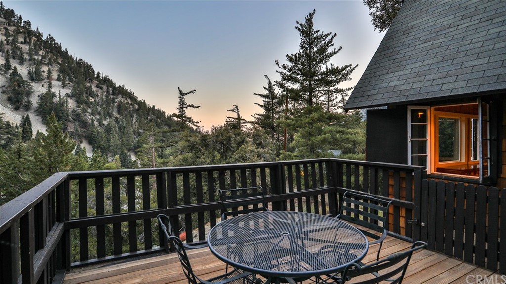 a view of a chair and table in the balcony