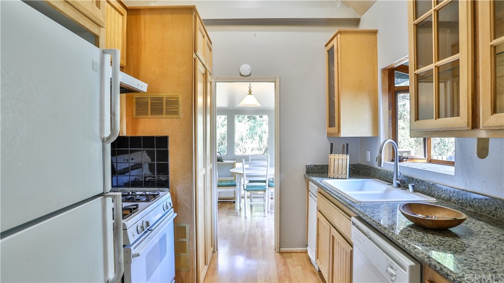35 Manker Flats Mt Baldy, CA 91759 - Photo 20 of 48 a kitchen with stainless steel appliances granite countertop a sink and a stove next to a window