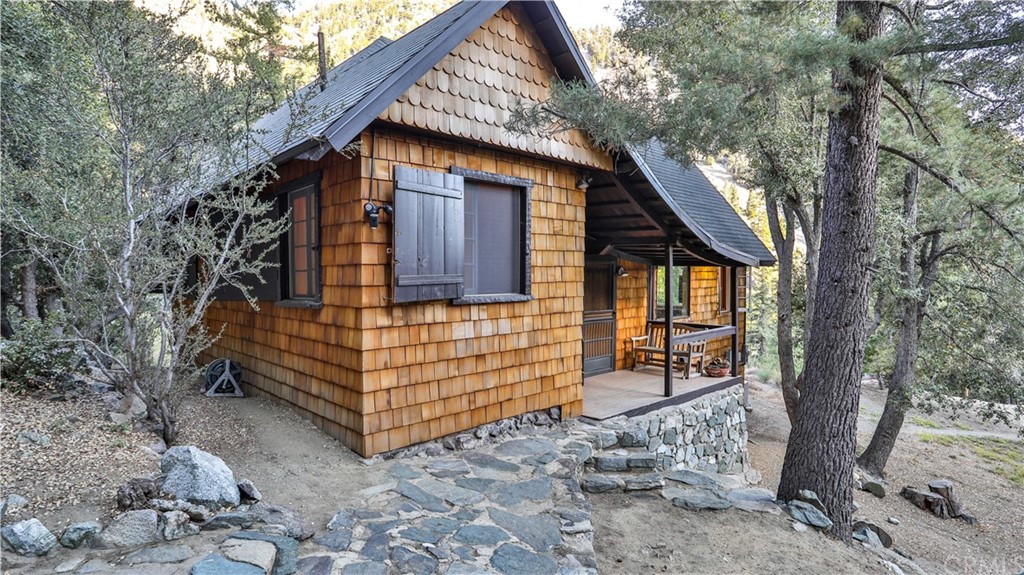 35 Manker Flats Mt Baldy, CA 91759 - Photo 2 of 48 a front view of a house with a yard