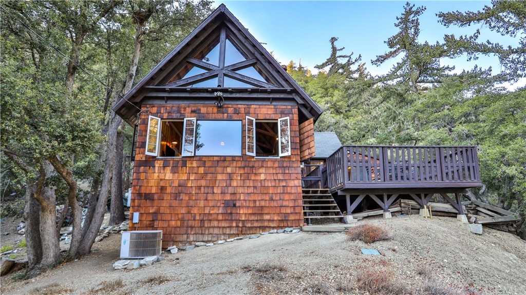 35 Manker Flats Mt Baldy, CA 91759 - Photo 7 of 48 a front view of a house with wooden stairs