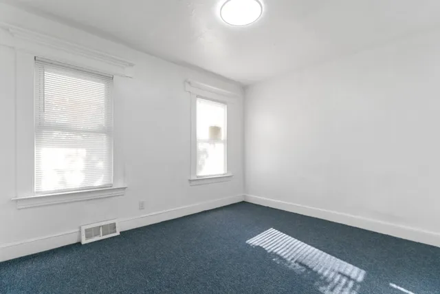an empty room with windows