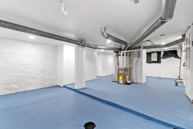 a view of empty room with wooden walls