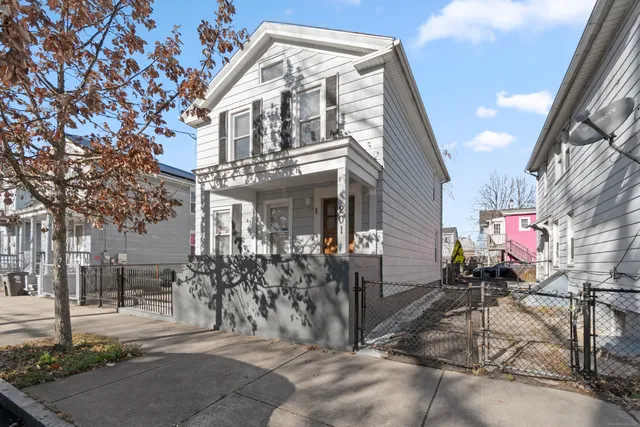 a view of a building with a bench and table chair
