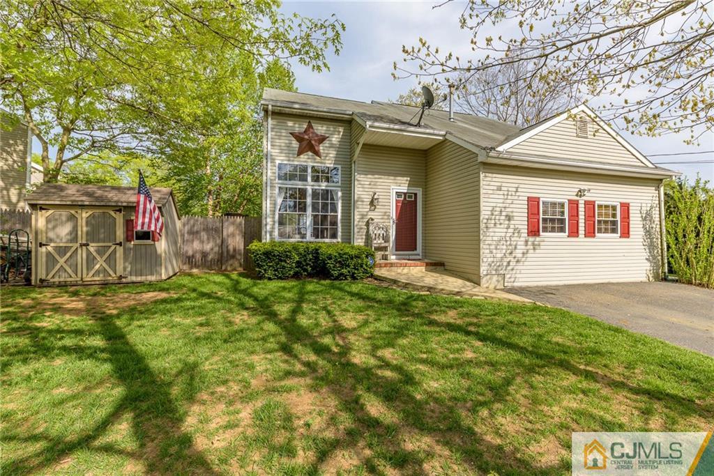 105 Quadrant Road Manahawkin, NJ 08050 - Photo 1 of 25 a front view of a house with a yard