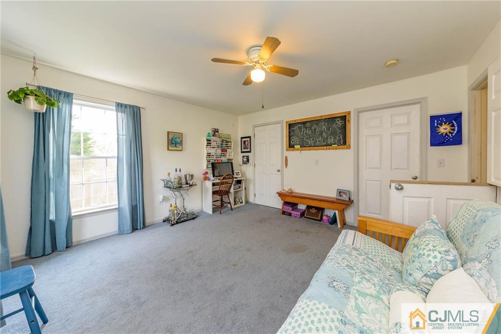 105 Quadrant Road Manahawkin, NJ 08050 - Photo 14 of 25 a living room with furniture and a flat screen tv