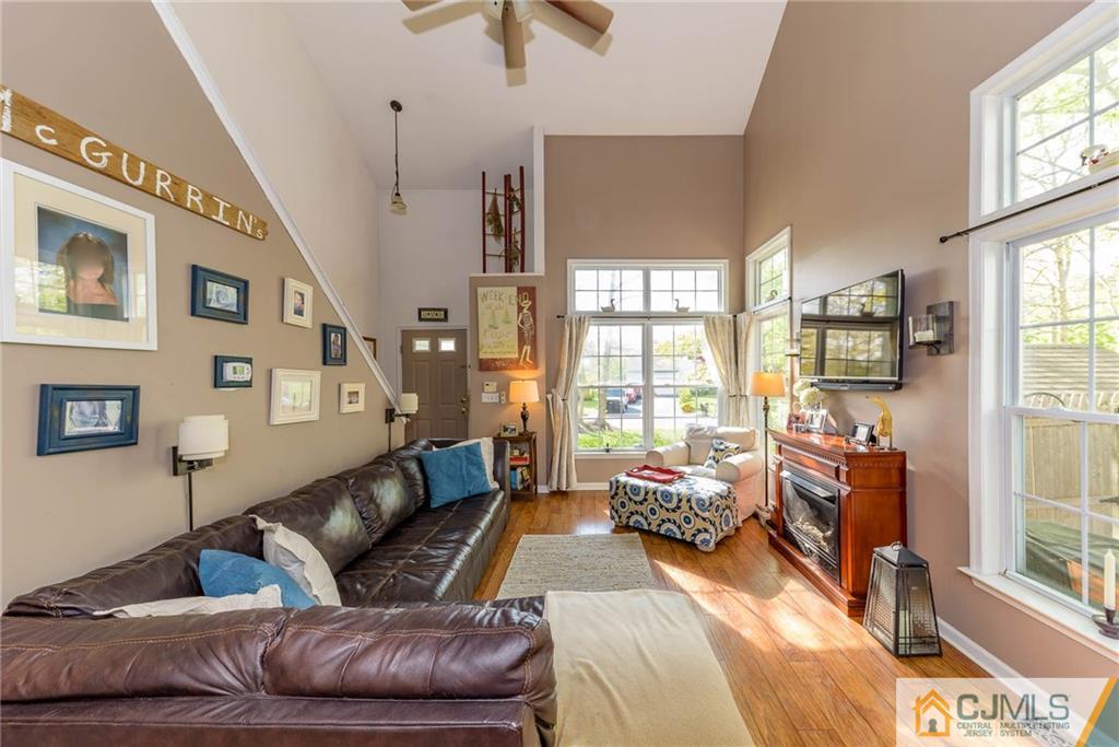 105 Quadrant Road Manahawkin, NJ 08050 - Photo 3 of 25 a living room with furniture and a large window