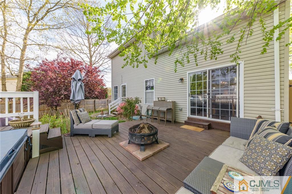 105 Quadrant Road Manahawkin, NJ 08050 - Photo 22 of 25 a view of a patio with couches and potted plants