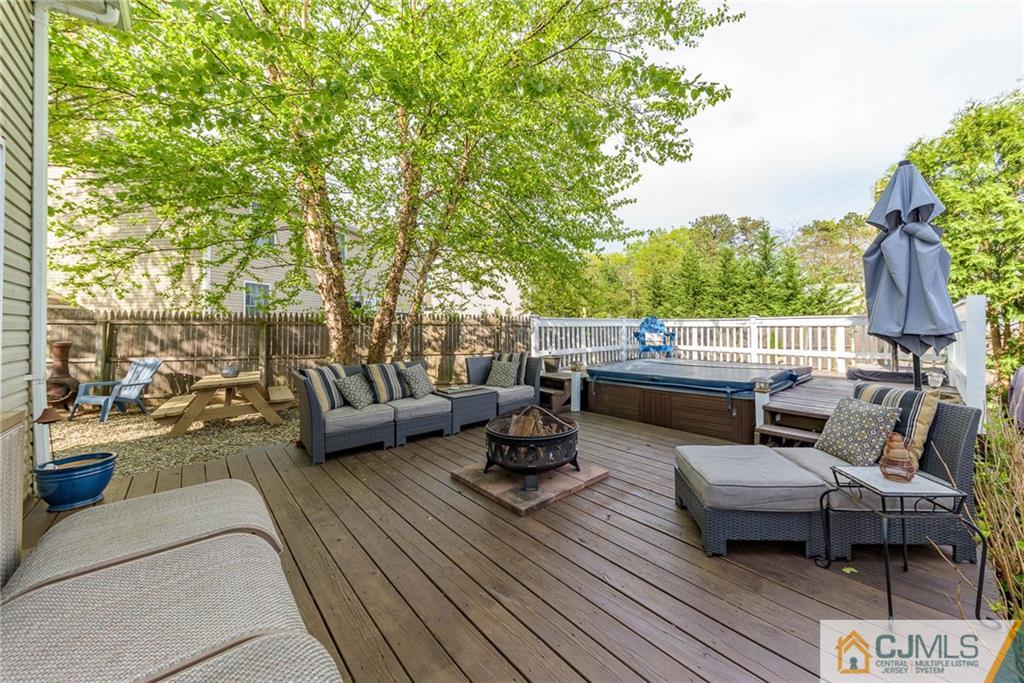 105 Quadrant Road Manahawkin, NJ 08050 - Photo 23 of 25 a view of a roof deck with couches and potted plants